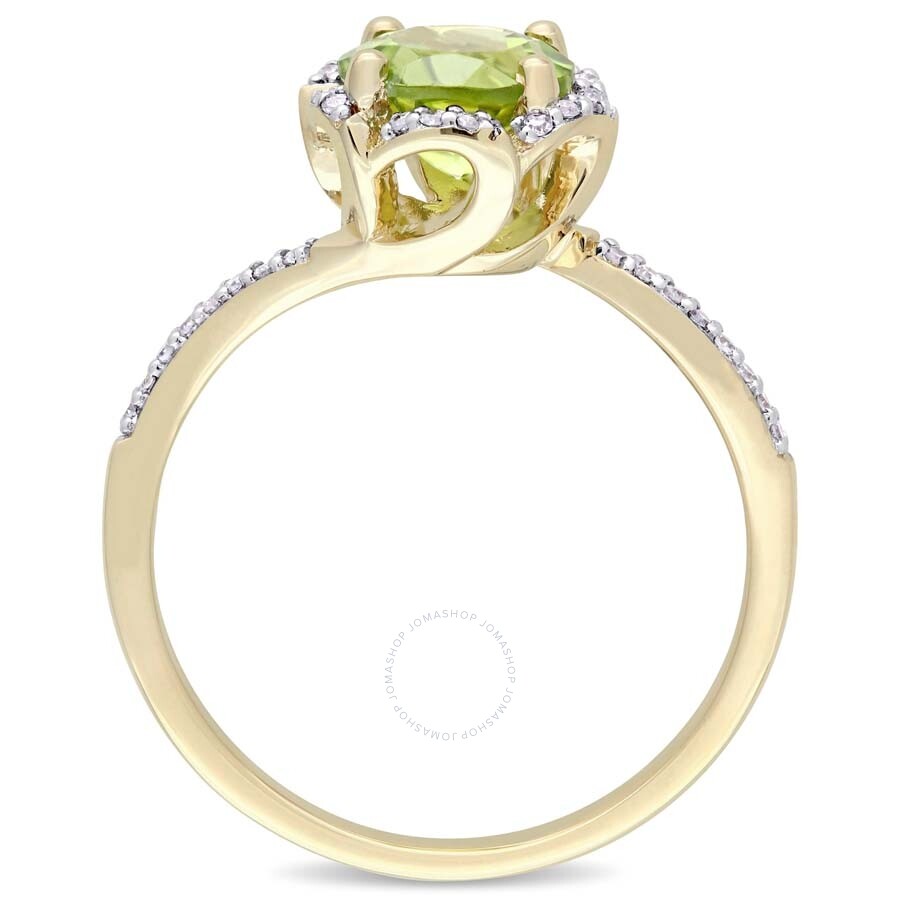 Shop Amour Peridot And 1/10 Ct Tw Diamond Halo Ring In 14k Yellow Gold In Green